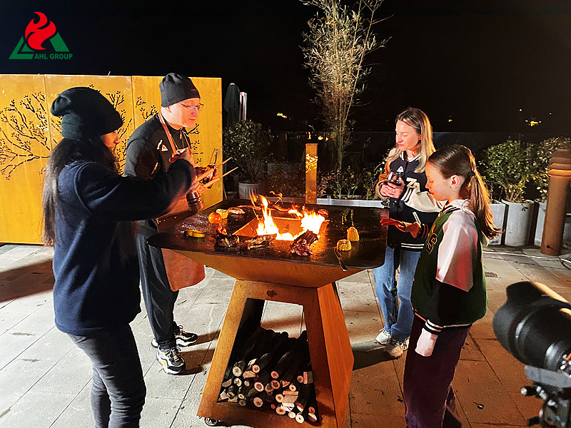 How to use a Corten Steel BBQ Grill at an Outdoor Party?